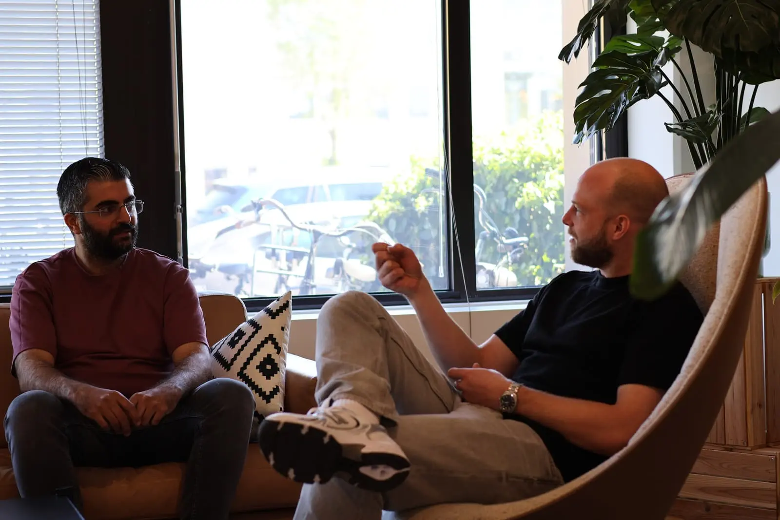 Farhad and Jan Pieter talking at the office